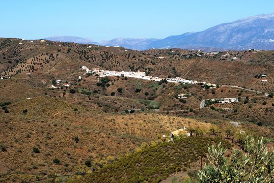 View of a typical Andaucian hamlet nestling in the hills (Pueblo Blanco, whitewashed village), Benaque, Andalusia, Spain.