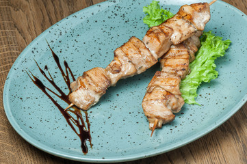 fried chicken on a wooden stick
