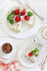 Sundae cake with strawberries and a cup of coffee