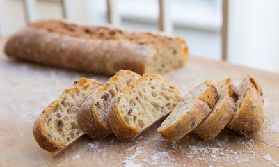 fresh loaf of bread on wooden board