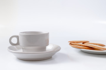 red breakfast cup and cookies on background