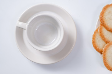 red breakfast cup and cookies on background