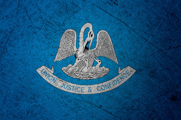Flag of louisiana, USA, on a grunge metal texture