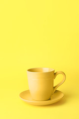 Blank cup on color background