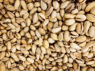 lots of delicious pistachio nuts for eating a background