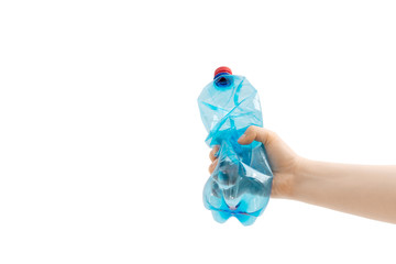 Сlose up of a blue plastic bottle in hand on white background.