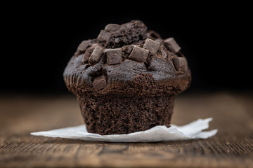 Some Chocolate Muffins (close-up shot; selective focus)