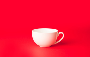 Blank cup on color background
