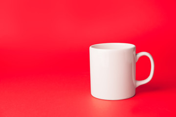 Blank cup on color background