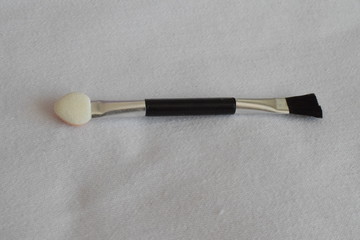 Makeup brush on a white background. The view from the top. 
