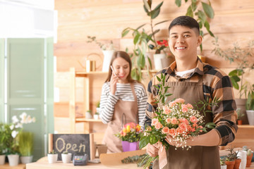 Portrait of Asian male florist in shop