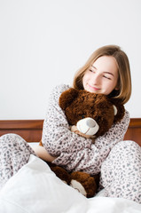 Teen girl with a teddy bear