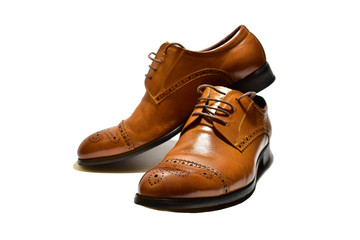 brown men's classic shoes on a white background. isolate closeup