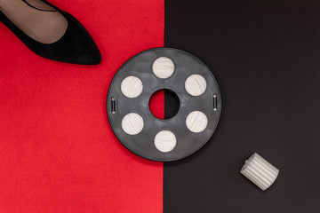 3D printing filament reel for 3d printers, and the printed part of a greek column and shoe are on a...