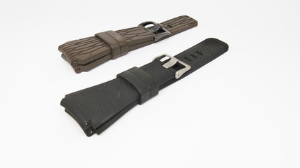 Closeup three straps watch isolated on white background. Brown rubber watch band, Black rubber watch band