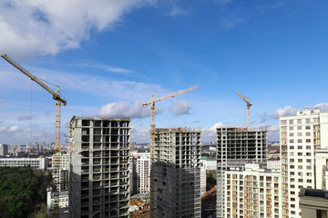 Fototapeta na wymiar City panorama, construction site with cranes