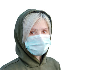 Isolated girl in a medical mask on a white background. disposable medical three-layer mask with elastic. Personal protective equipment. isolate