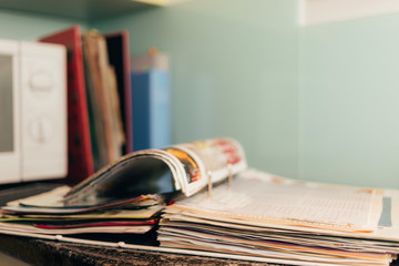 Large ring folder full of recipe sheets lying open on the kitchen counter.