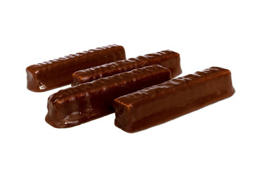 Dessert for tea. sweet brown chocolate wafers with caramel on a white background. isolate