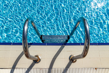 Grab bars ladder in the swimming pool