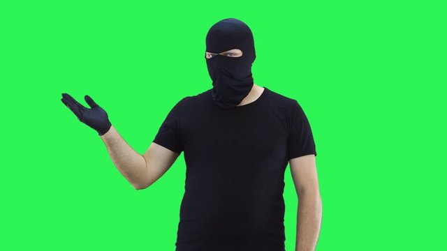 A man in a balaclava offers to make a choice,green screen background