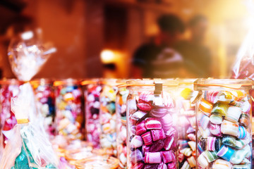 Blur background of delicious sweet beautiful fantasy colourful jar box of candy treat for summer holiday kids gift souvenir. Eat too much bonbon lollipop sugar is toxic unhealthy nutrition addiction