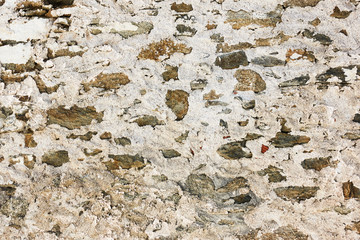 Texture of stone masonry with rough stucco