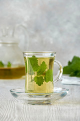 Fresh natural melissa , lemon baim herbal tea in glass cup.