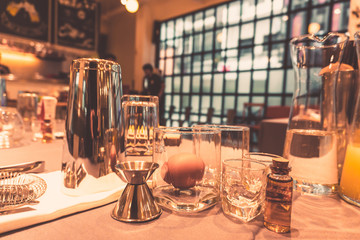 Background of cocktails mixing workshop preparation on counter bar. Professional bartender club preparing fresh delicious tasty cocktail alcohol liquor drink using beverage shaker on vintage concept