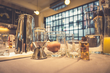 Background of cocktails mixing workshop preparation on counter bar. Professional bartender club...