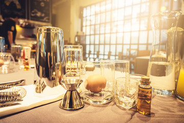 Background of cocktails mixing workshop preparation on counter bar. Professional bartender club preparing fresh delicious tasty cocktail alcohol liquor drink using beverage shaker on vintage concept