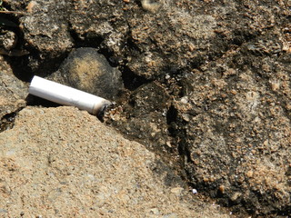 cigarrette on concrete