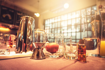 Background of cocktails mixing workshop preparation on counter bar. Professional bartender club preparing fresh delicious tasty cocktail alcohol liquor drink using beverage shaker on vintage concept