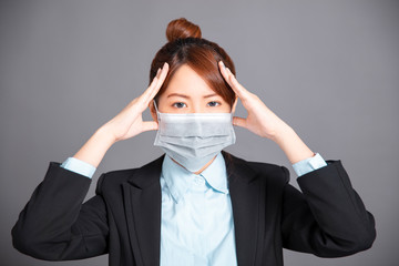 young woman wear medical mask with  headache  concepts