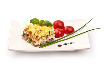 Mimosa, Layered Fish Salad, Traditional russian cuisine, isolated on white background.