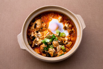 Korean spicy silken tofu stew which is called Sundubu Jjigae