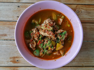 Homemade fresh cookes real traditional local exotic spicy Thai Jungle curries (Kaeng Pa) serve with chicken, pork, beef meats, vegetable, herbs No filter healthy vegetable soup from street food 