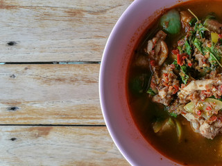 Homemade fresh cookes real traditional local exotic spicy Thai Jungle curries (Kaeng Pa) serve with chicken, pork, beef meats, vegetable, herbs No filter healthy vegetable soup from street food 