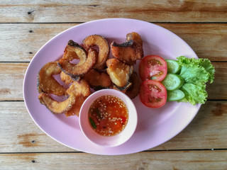 Homemade fresh cookes real traditional local exotic Thai asia deep fish fillet (Pla Tod) serve with sweet sauce. No filter deep fried healthy snack appetizer meal from street food restaurant