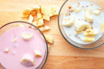 Whole grain oatmeal porridge with milk, healthy breakfast food. Morning routine cooking oats granola.