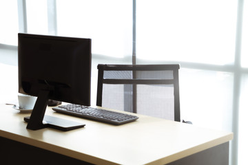 Modern office desk with computer work station. Concept of empty job, out of office, nobody.
