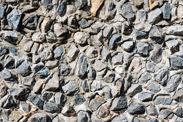 modern style design decorative uneven cracks of the real surface of the stone wall with cement