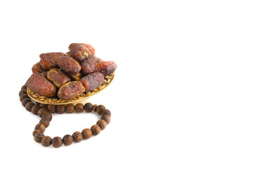 Date fruits or dry dates isolated on white background.Ramadan Kareem Breaking the fast by eating Tamar Dates