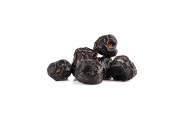 Ajwa Dates fruits or dry dates isolated on white background.Ramadan Kareem Breaking the fast by eating Tamar Dates