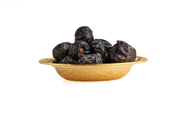 Ajwa Dates fruits or dry dates isolated on white background.Ramadan Kareem Breaking the fast by eating Tamar Dates
