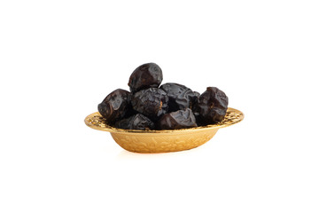 Ajwa Dates fruits or dry dates isolated on white background.Ramadan Kareem Breaking the fast by eating Tamar Dates