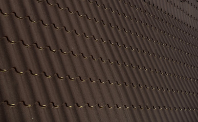 Close up a part of a brown roof of a house.