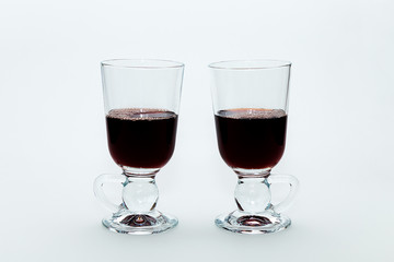 Two windows with hot mulled wine on a white background.