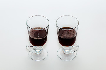 Two windows with hot mulled wine on a white background.