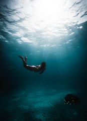 Girl diving in the middle of the Caribbean Sea